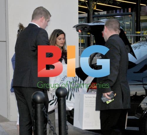 Carly Zucker loads shopping bags in Liverpool