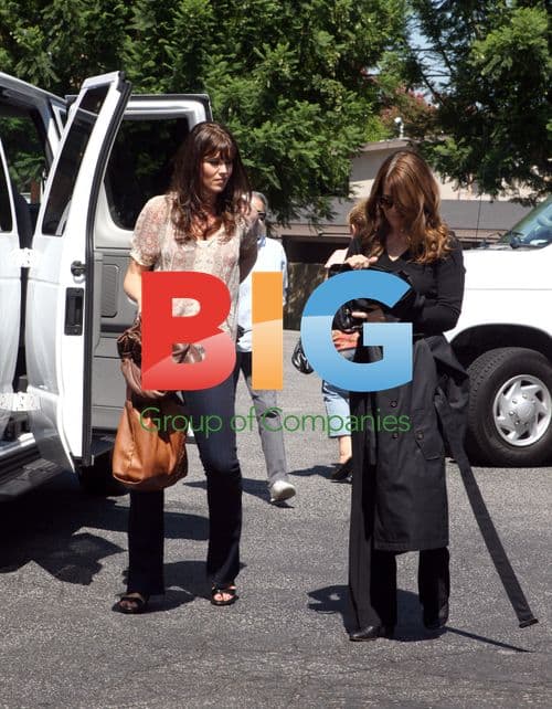 Sarah Lancaster with Leather Bag