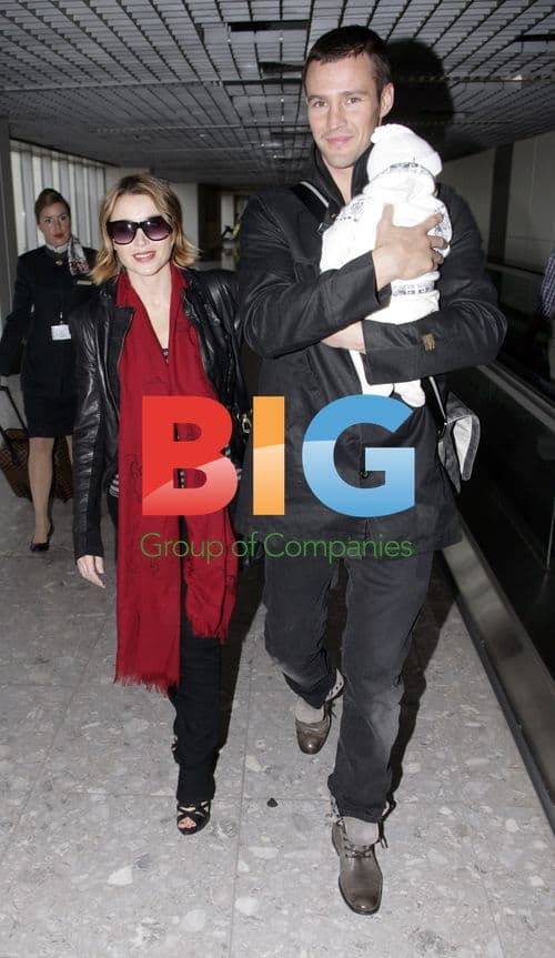 Dannii Minogue and family arrive in London