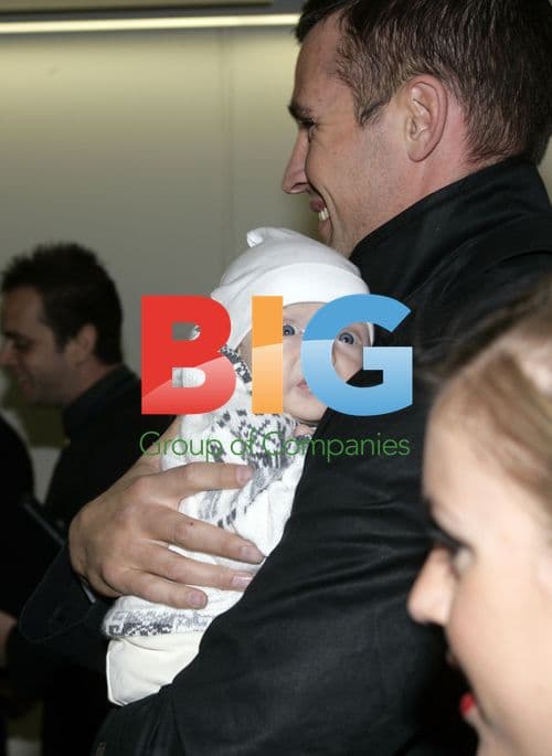 Dannii Minogue and family arrive in London