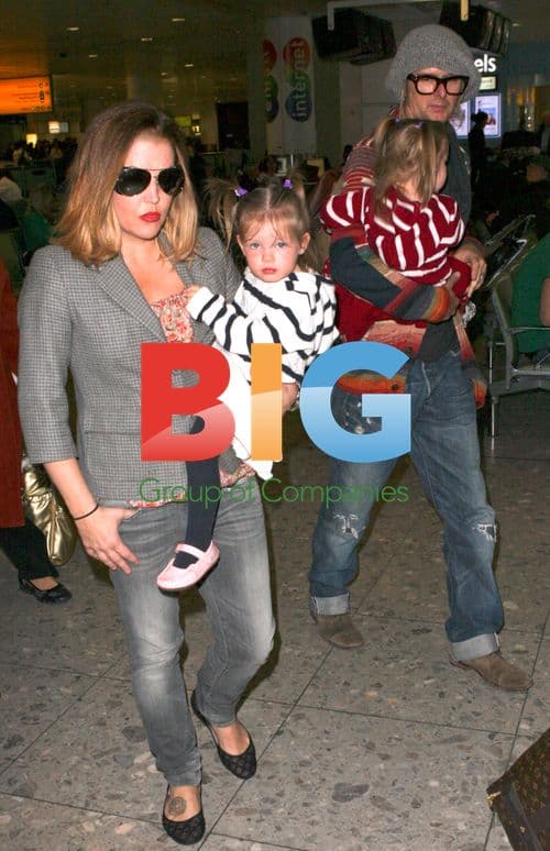 Lisa Marie Presley Arrives with Daughters and Boyfriend