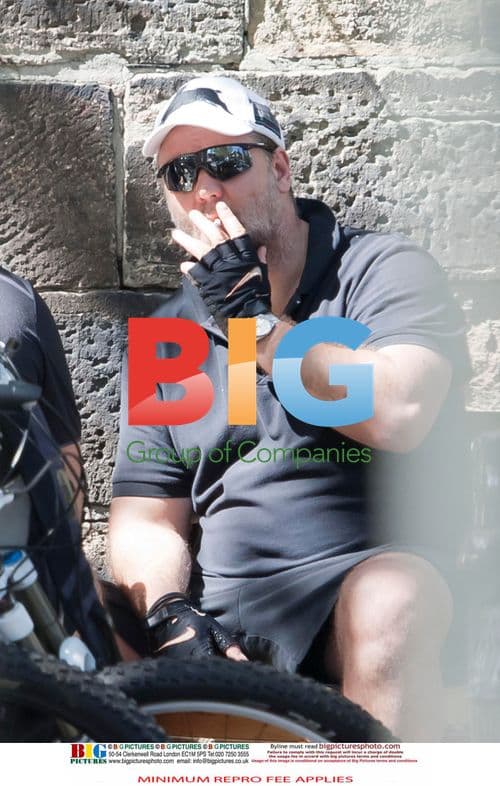 Russell Crowe Takes Smoke Break, Bikes