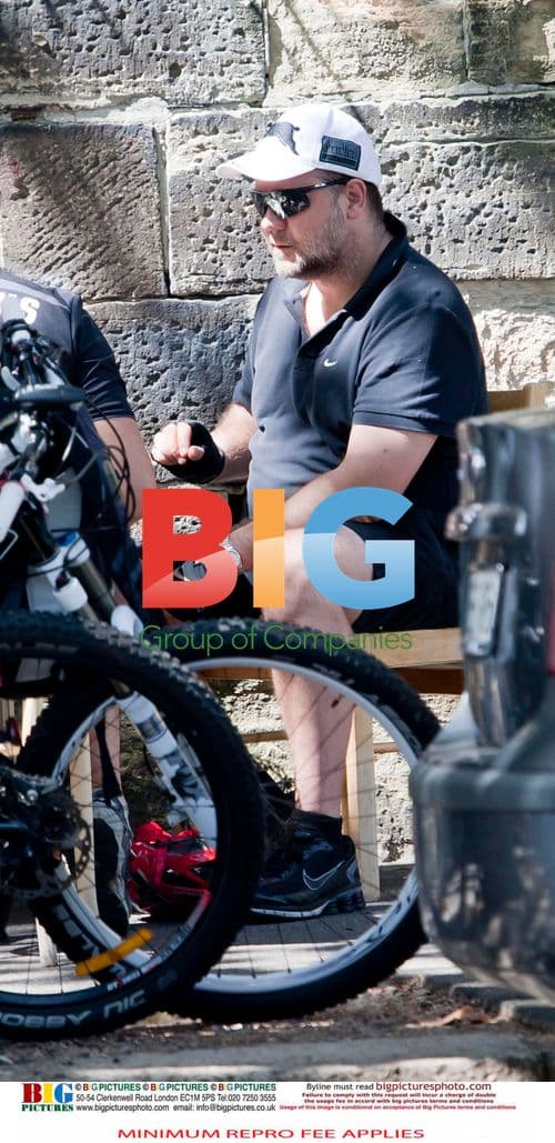 Russell Crowe Takes Smoke Break, Cycles