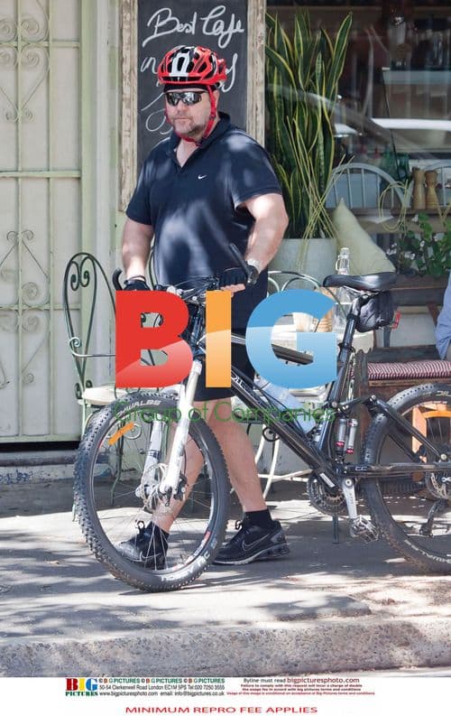 Russell Crowe Takes Smoke Break, Bikes