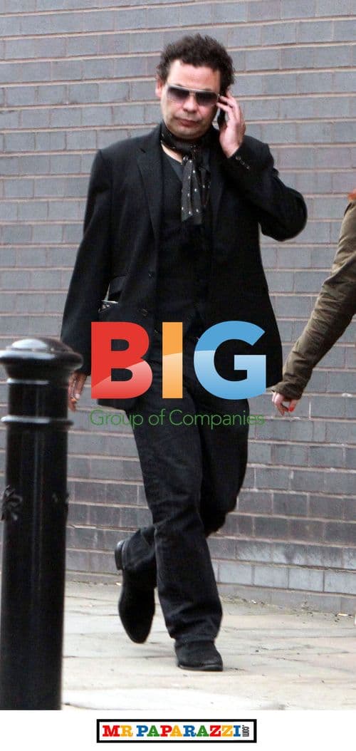 Craig Charles Walks with Friend Near Corrie Studios