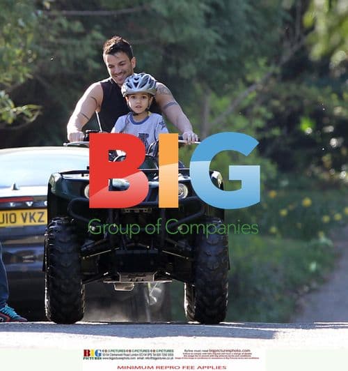 Peter Andre and son on quad bike