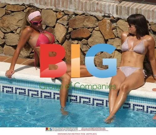 Katie Price Relaxes Poolside in Spain