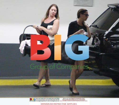 Victoria Beckham Leaves Office with Baby Harper