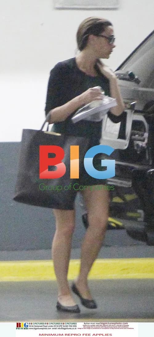 Victoria Beckham Leaves LA Office with Baby Harper