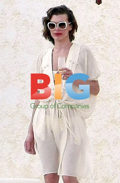 Milla Jovovich Toasts Champagne with Husband in Mexico