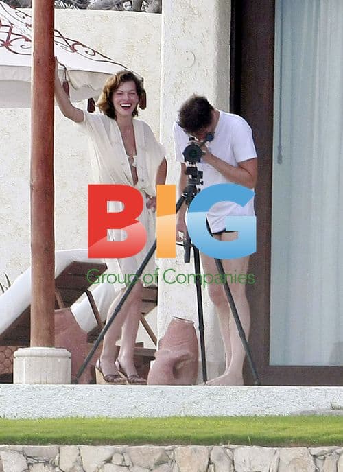 Milla Jovovich Toasts Champagne with Husband Paul W.S. Anderson