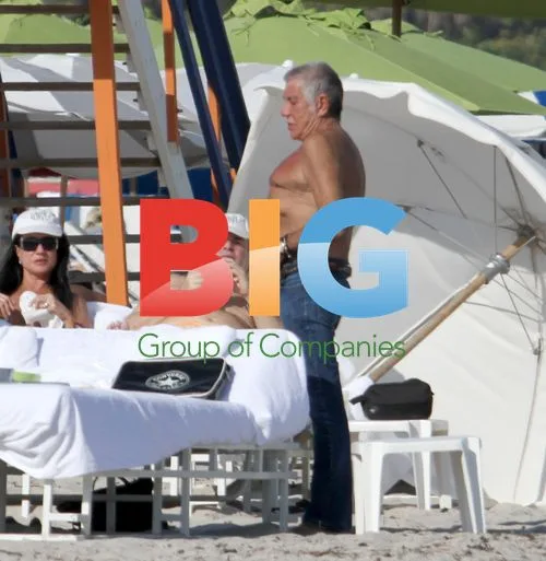 Roberto Cavalli Enjoys Beach Day with Girlfriend