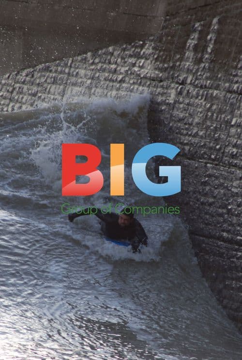 Surfer Rides Wave Near Wall