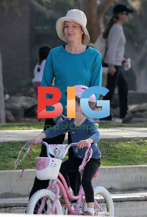 Marcia Cross rides daughter's bike