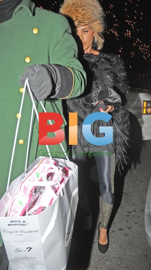 Katie Price Spotted with Personal Aid in London