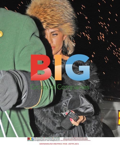 Katie Price Seen with Personal Aid in London