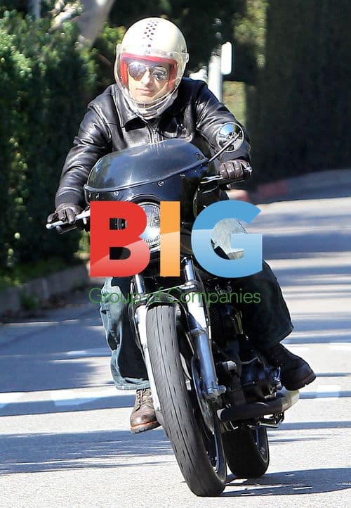 Olivier Martinez Rides Motorcycle in Brentwood