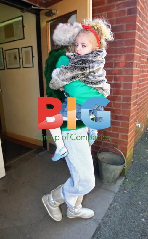 Katie Price leaves home, photographs paparazzi