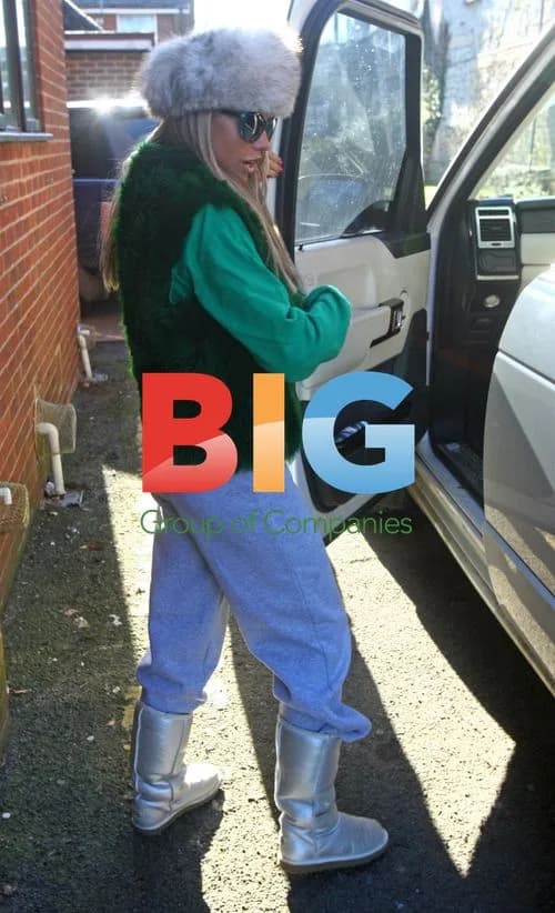 Katie Price leaves home, photographs paparazzi