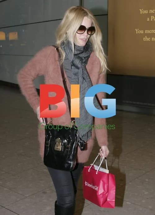 Claudia Schiffer Arriving at Heathrow