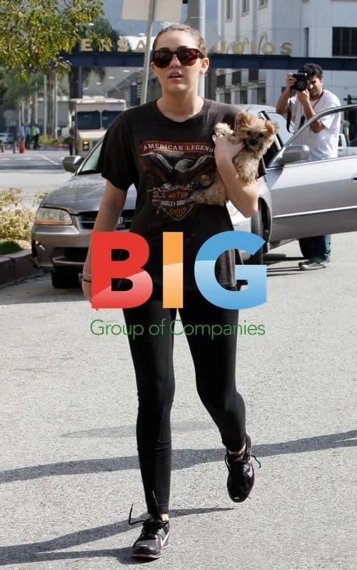 Miley Cyrus and Puppy Visit Neighbors