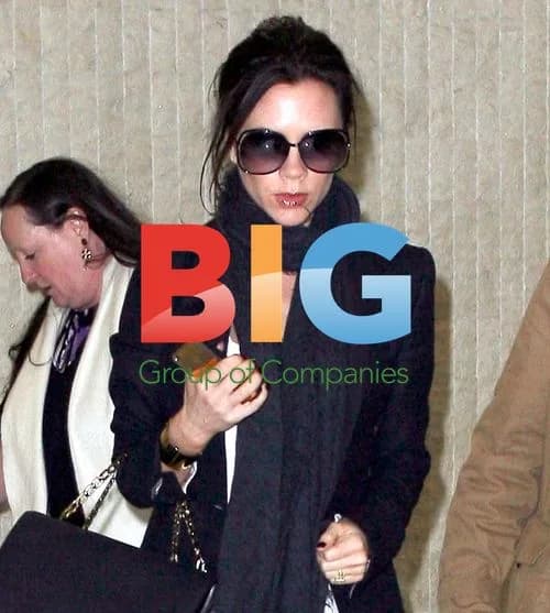 Victoria Beckham looks worn out at JFK