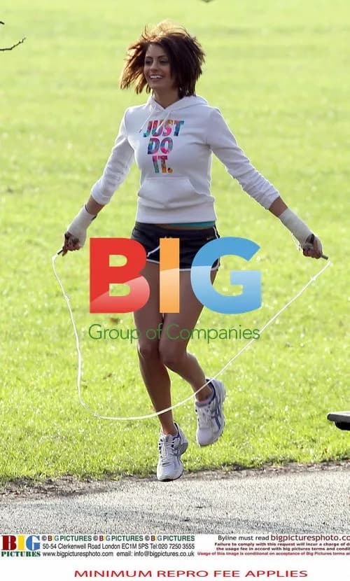 Liz Locke works out with trainer in London park
