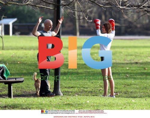 Liz Locke exercises with personal trainer in London park