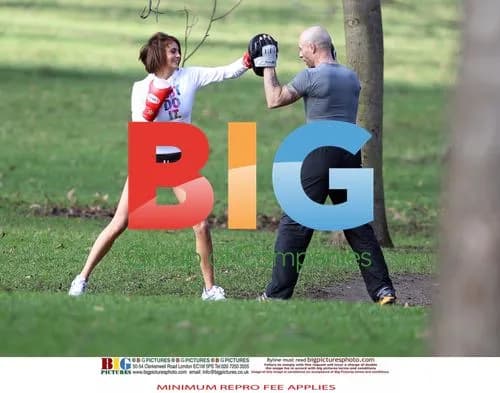 Liz Locke Exercising with Trainer