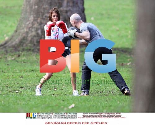 Liz Locke exercises with trainer in London park