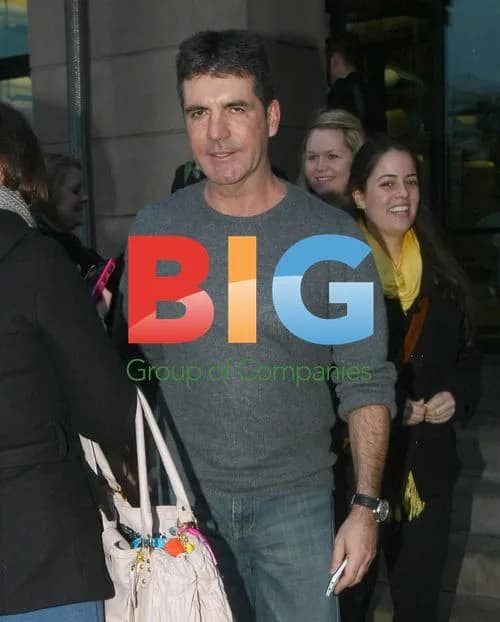 Simon Cowell Besieged by Fans in London