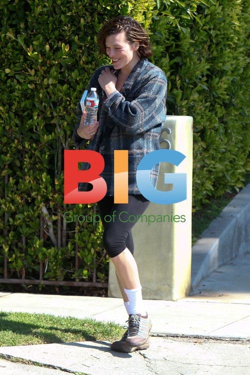 Milla Jovovich Leaving Gym with Diet Books