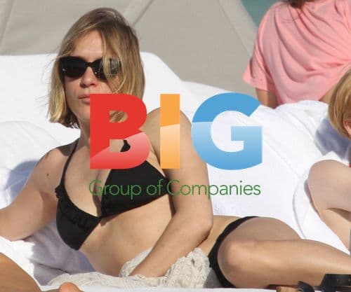 Chloe Sevigny relaxing on the beach with friends