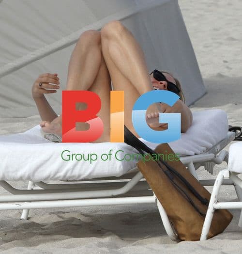 Chloe Sevigny Relaxing on the Beach