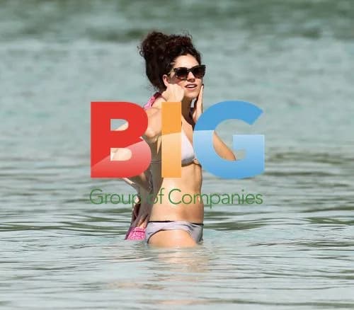 Eliza Doolittle swims with friend in Barbados