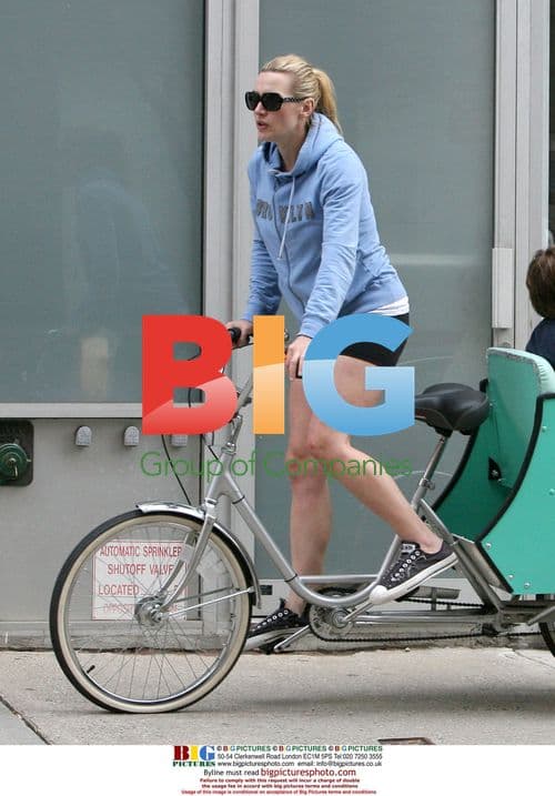 Kate Winslet Arrives by Tricycle