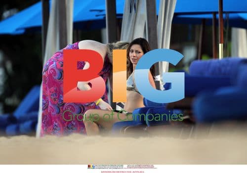 Claire Nasir in Gold Bikini in Barbados