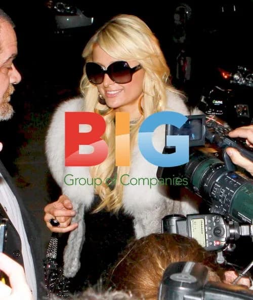 Paris Hilton mobbed by paparazzi at store opening