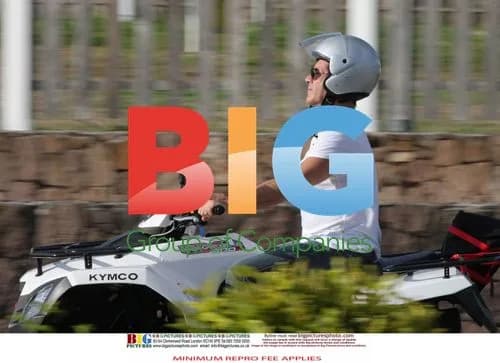 Simon Cowell and Mezhgan Hussainy on Quad Bike