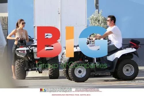 Simon Cowell and Mezhgan Hussainy on Quad Bikes in Caribbean