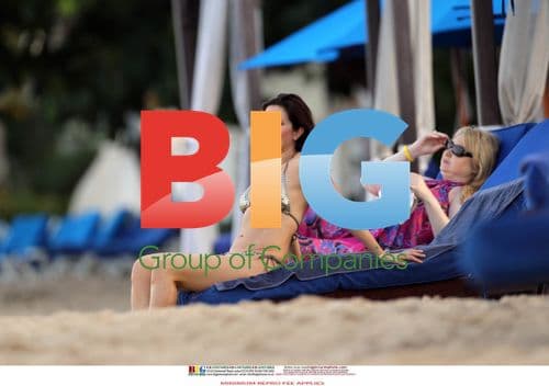 Clare Nasir in Gold Bikini on Beach