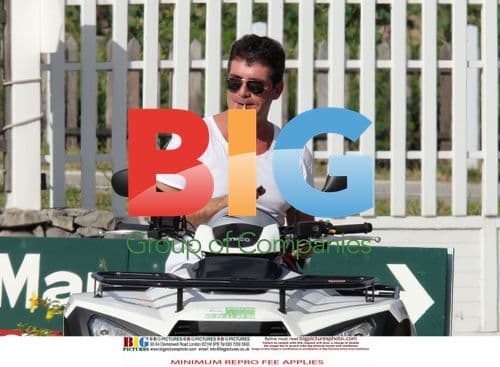 Simon Cowell and Mezhgan Hussainy on Quad Bikes