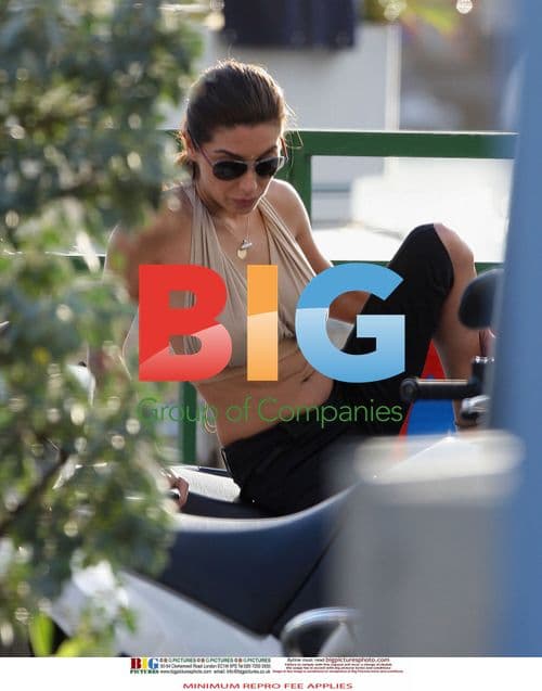 Simon Cowell and Mezhgan Hussainy on Quad Bikes