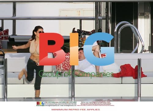 Simon Cowell and Mezhgan Hussainy on Quad Bikes