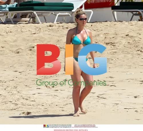 Claire Sweeney Relaxes in Turquoise Bikini