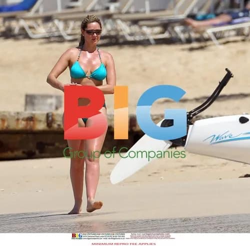 Claire Sweeney Relaxes in Turquoise Bikini