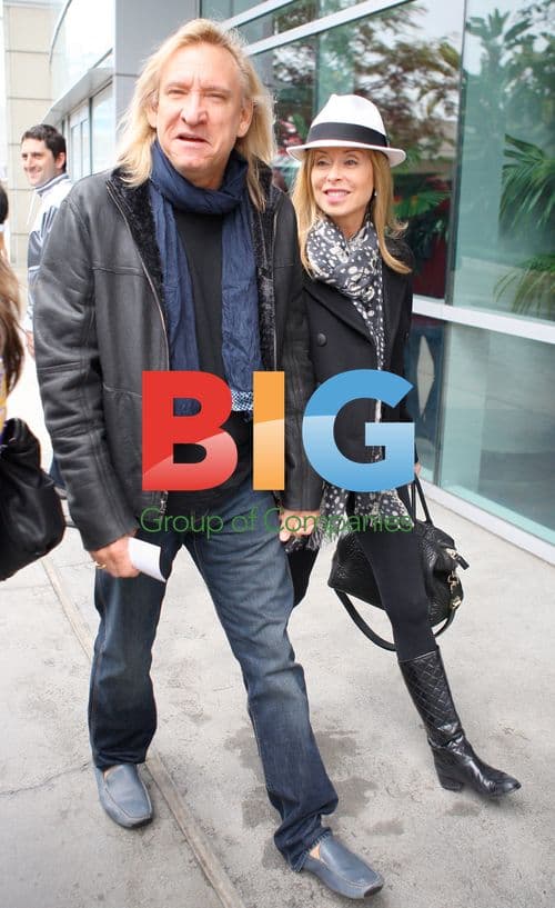 Joe Walsh Leaving Laker Game in Rain