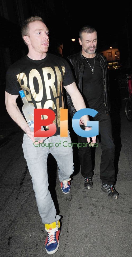 George Michael and Friend Enjoy Evening Outing