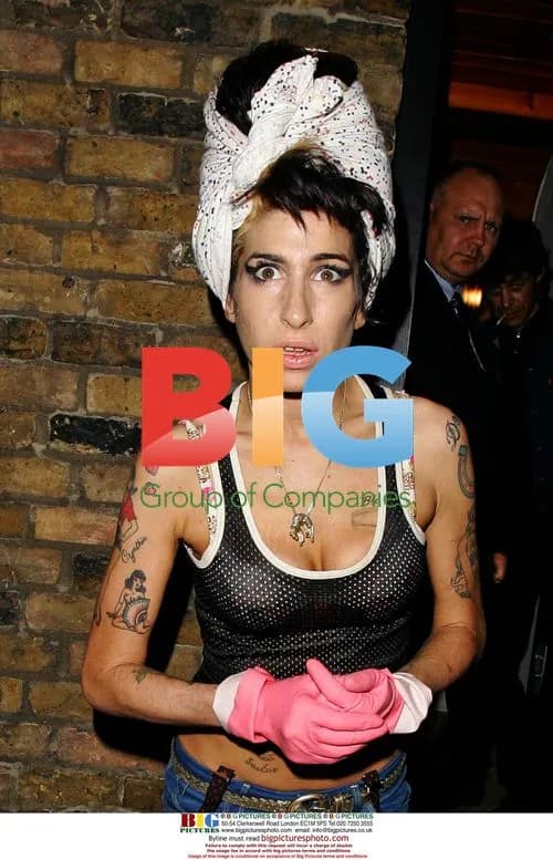 Amy Winehouse Cleaning House in Marigolds
