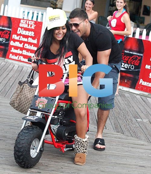 Snooki on mini motorcycle with Ronnie